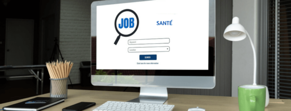 Bureau avec un ordinateur affichant 'Santé', représentant les recherches d'emploi dans la santé